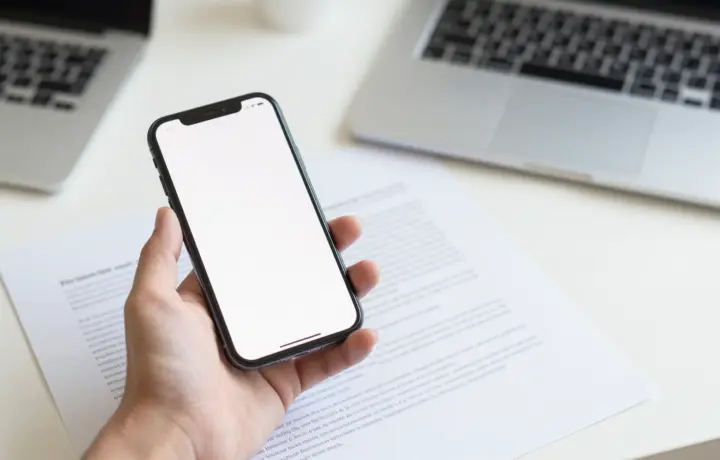 Person sending a fax from an iPhone using a fax app in 2026