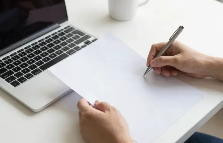 FaxZero review, sending a free fax from a laptop on a bright desk